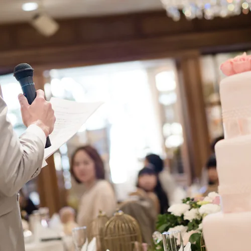 Guests raising glasses for a wedding toast